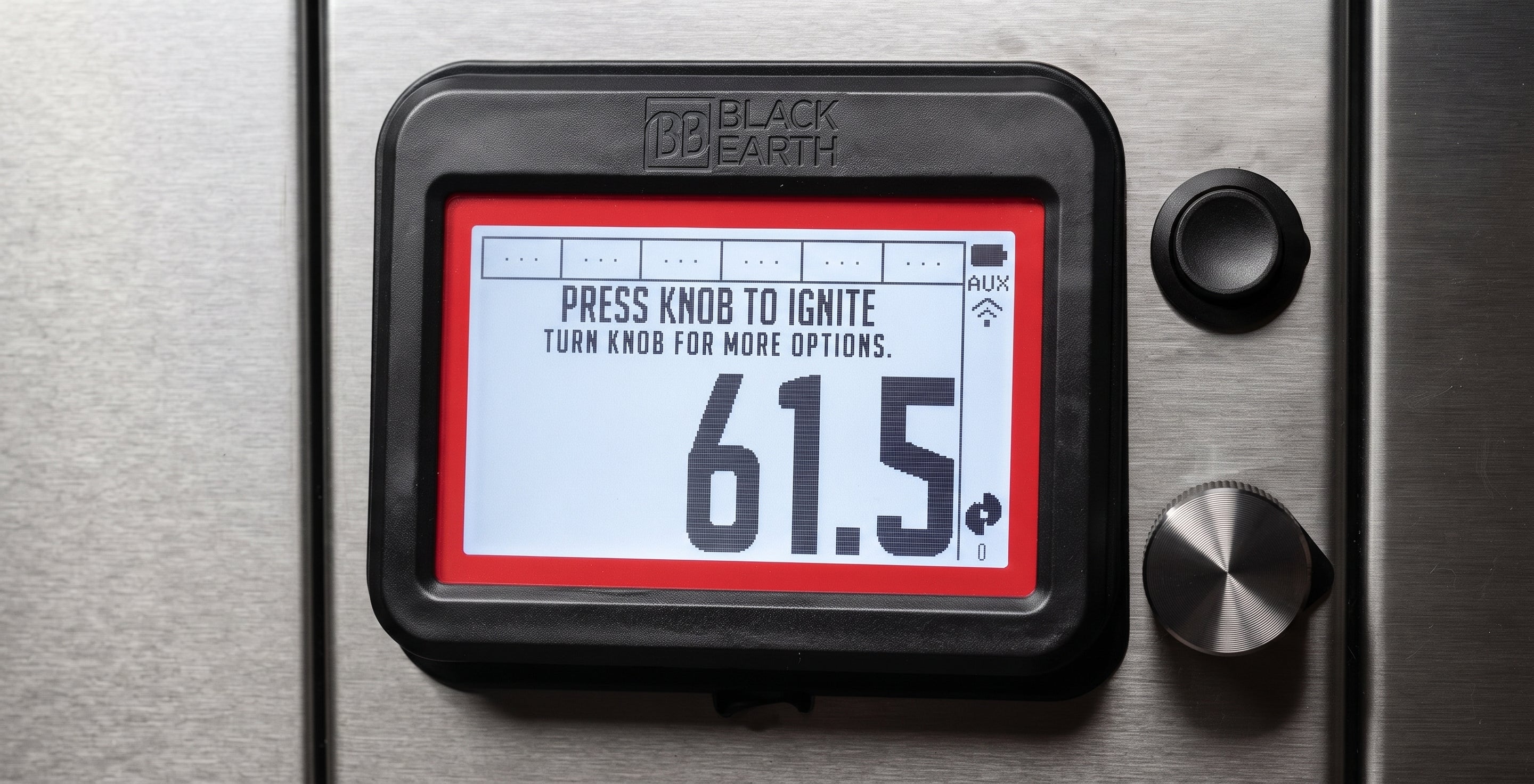 A close-up of a Black Earth digital fuel gauge display mounted on a brushed metal surface. The black bezel shows a white screen with a red border and large numbers reading 61.