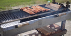 Close-up of ribs cooking.